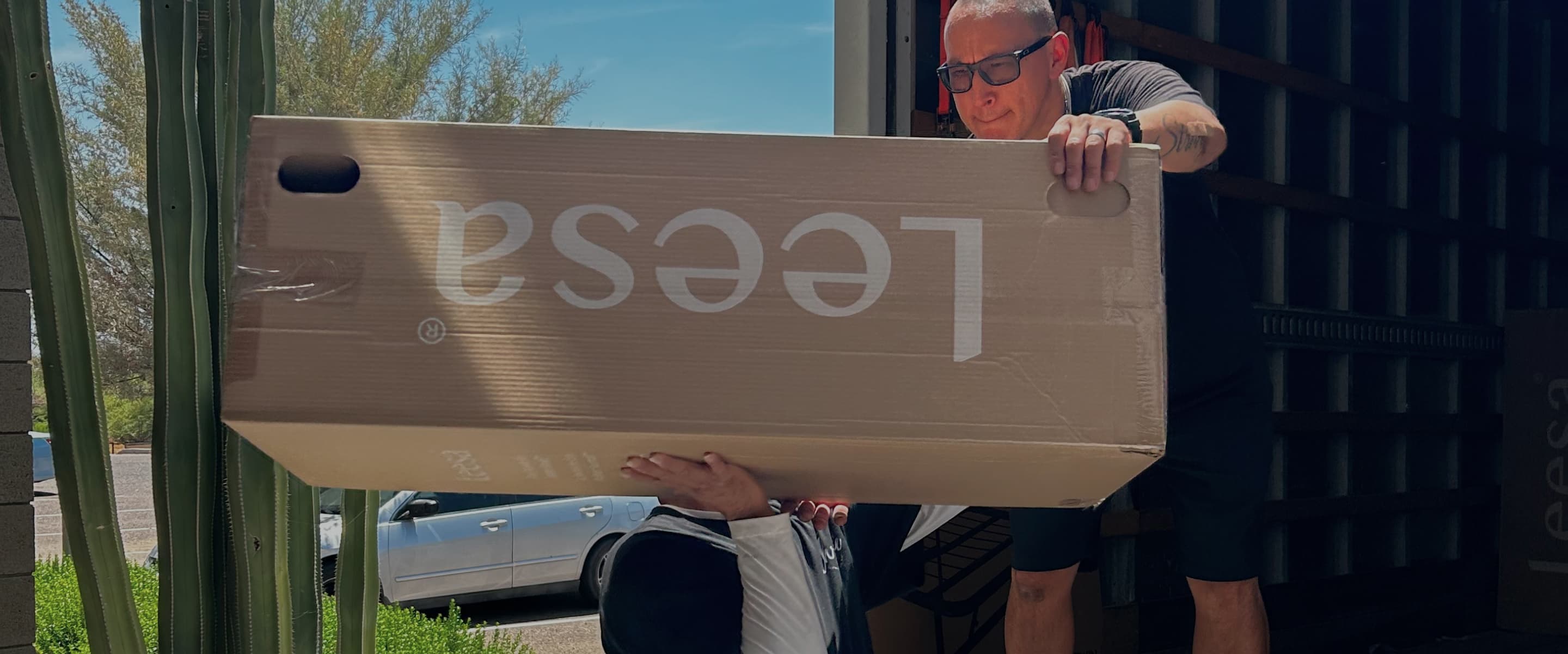 Leesa mattress box being unloaded from truck
