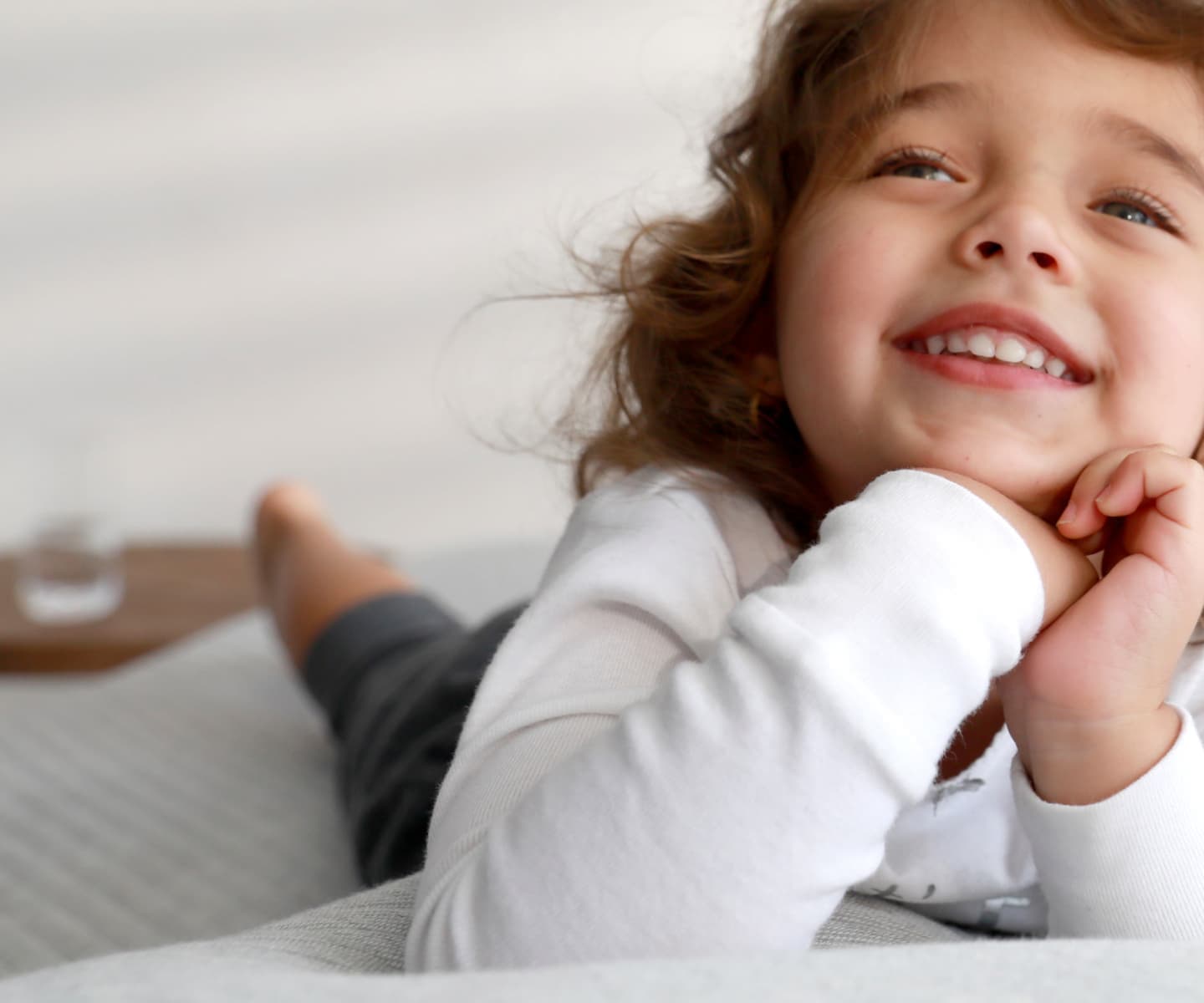 Child smiling on a Leesa mattress